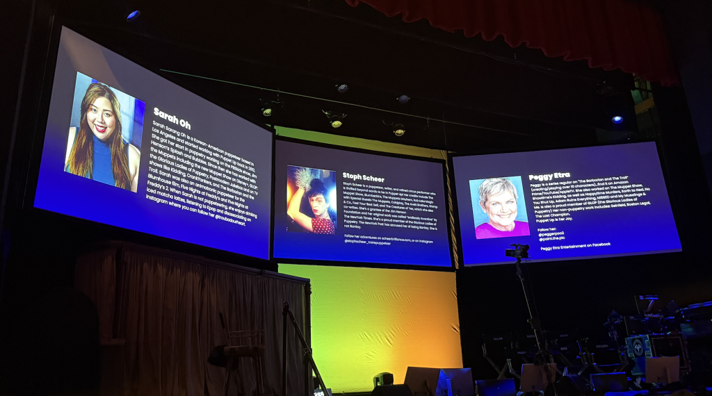 The stage with the giant screen sabove it. Photo by Karen Salkin.
